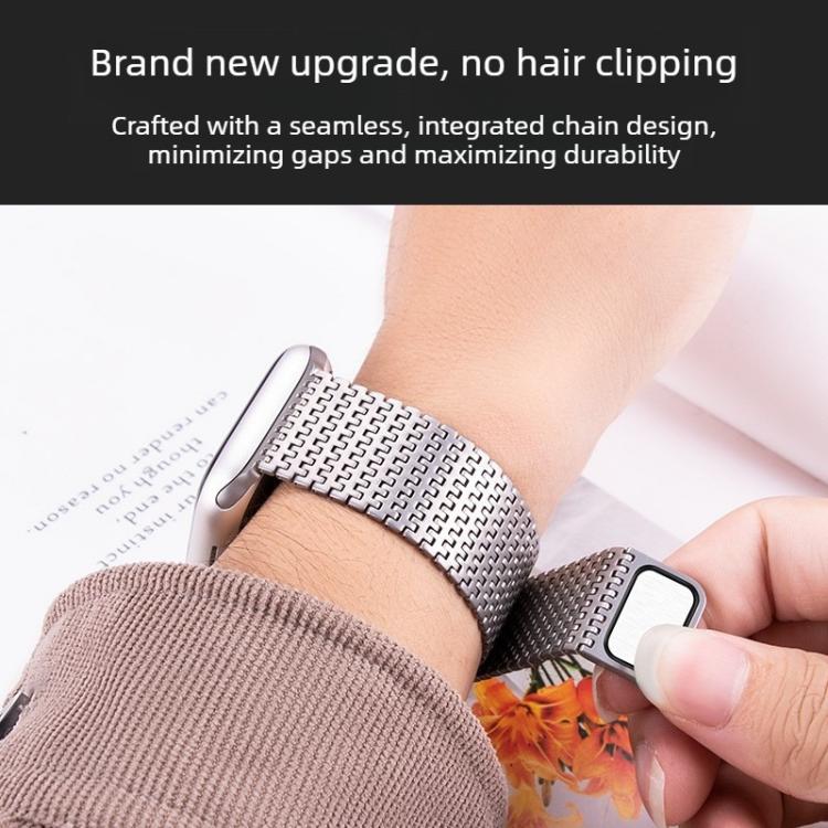 Silver pin-chain watch band fastened around a wrist.