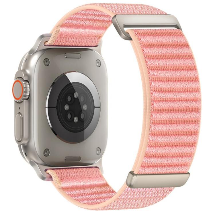 Apple Watch nylon hook-and-loop band in pink with a two-section woven pattern.