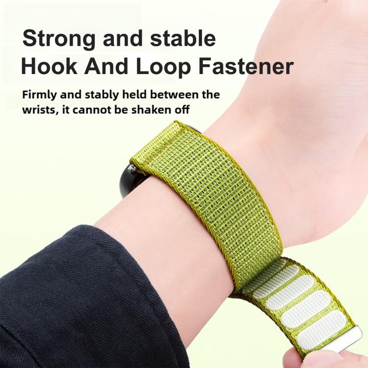 Bright green Apple Watch nylon band worn on a wrist, showing the hook-and-loop fastening.