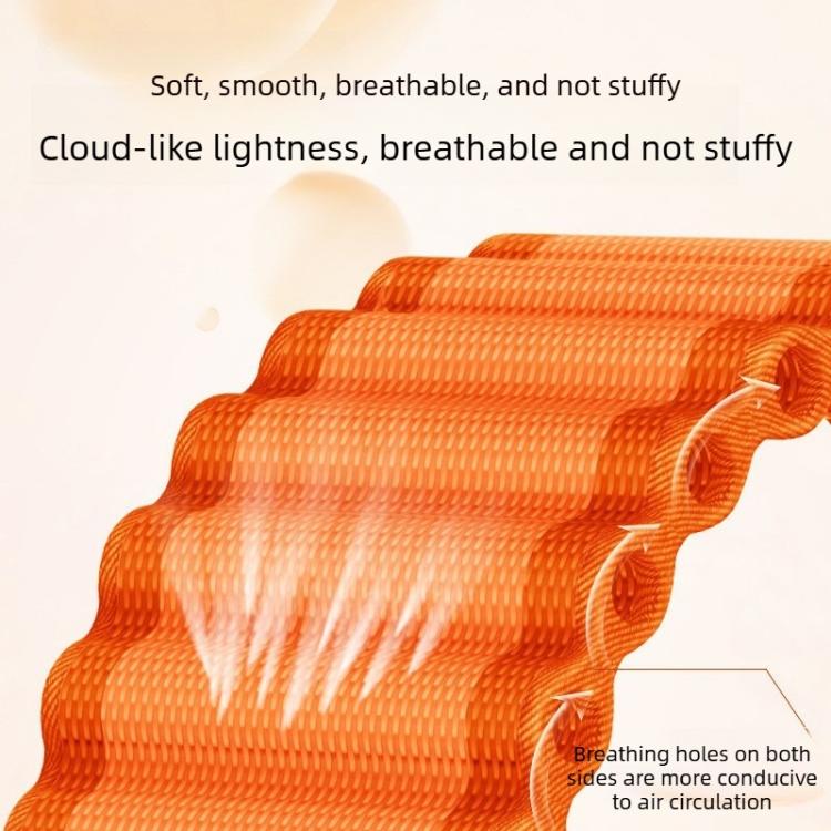 Close-up of orange braided nylon watch band showing textured weave and ventilation holes
