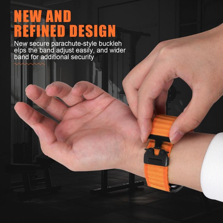 Orange ribbed nylon watch band with black parachute buckle, shown being adjusted on a wrist