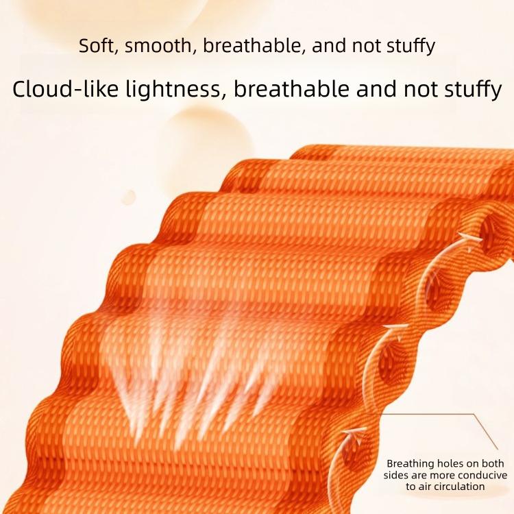 Orange ribbed nylon watch band close-up showing textured weave and ventilation holes