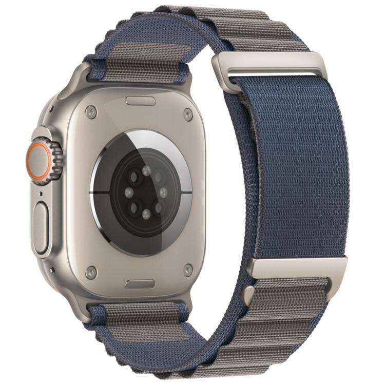 Blue-gray nylon Apple Watch band with two-section loop and metal buckles