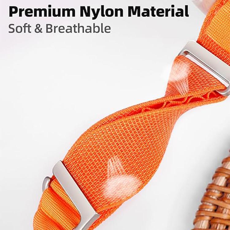 Close-up of orange woven nylon watch band showing its breathable mesh texture