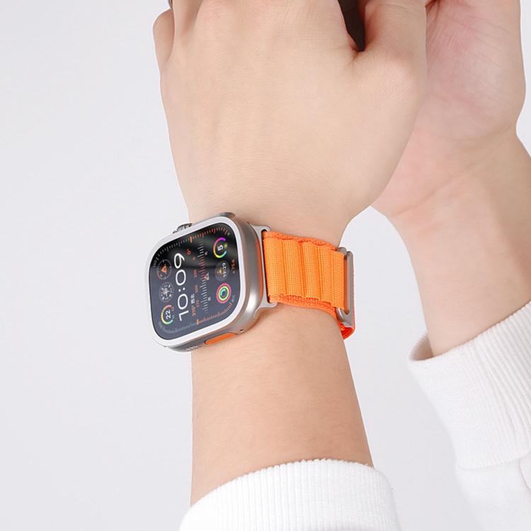 Orange nylon two-section loop band worn on an Apple Watch