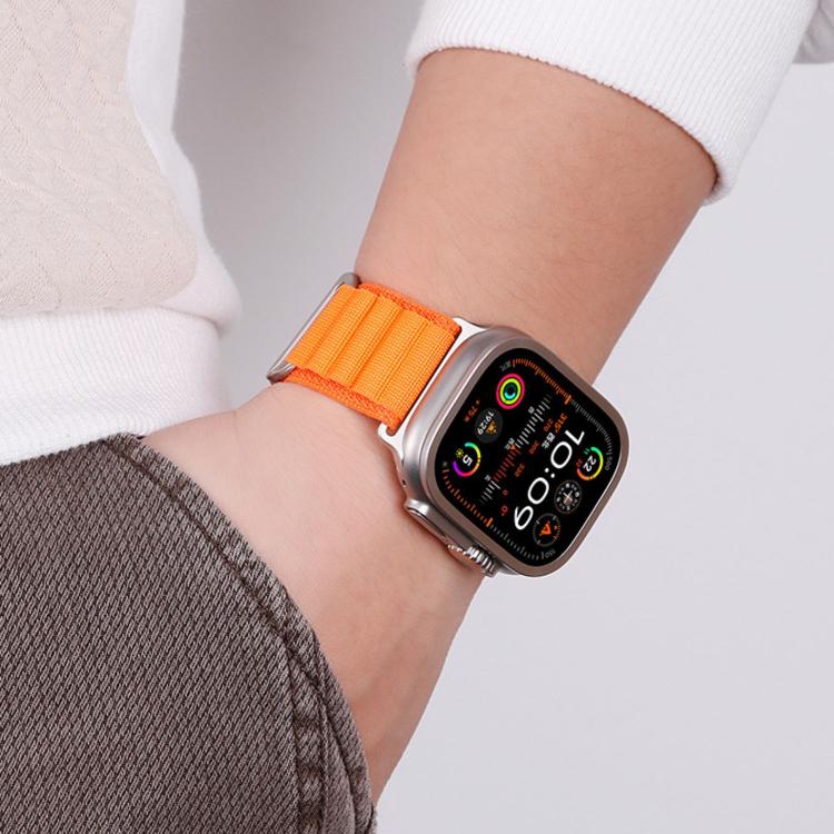 Apple Watch with bright orange two-section nylon loop band on a wrist