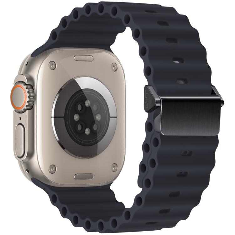 Dark blue silicone watch band and the back of a compatible watch, showing the magnetic buckle