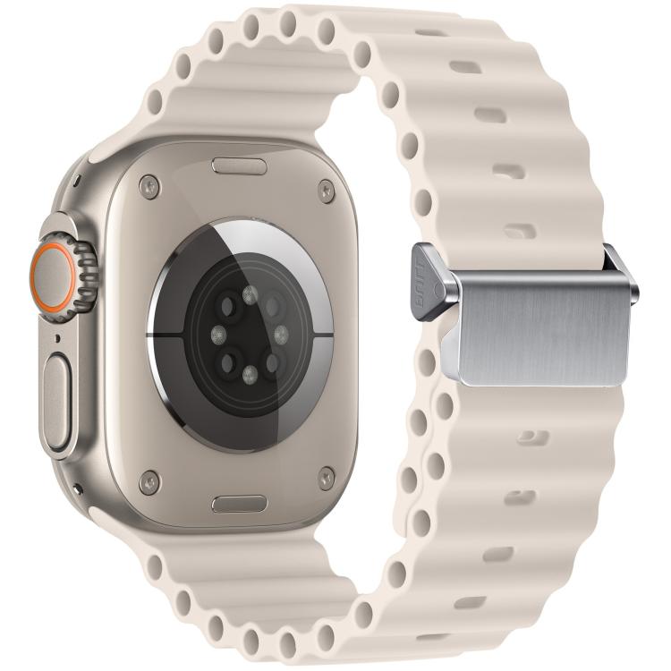 White silicone watch band and the back of a compatible watch, showing the magnetic buckle