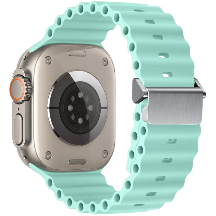 Light mint Ocean silicone Apple Watch band with magnetic buckle, shown on a watch