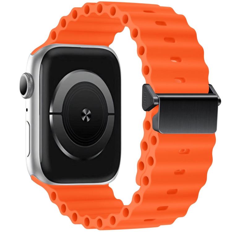 Orange silicone watch band with magnetic buckle shown attached to a smartwatch