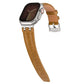 Brown vegan leather watch band with silver buckle, shown attached to a smartwatch