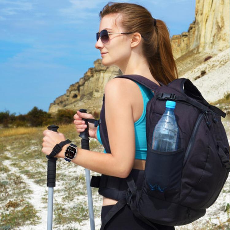 Navy nylon Apple Watch band worn on a wrist while hiking