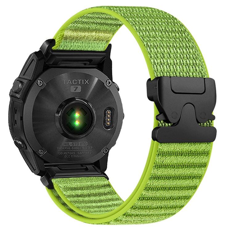 Lime green woven nylon watch band with black parachute buckle on a black watch