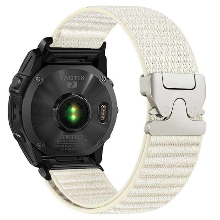 Ivory woven nylon watch band with light metal parachute buckle on a black watch