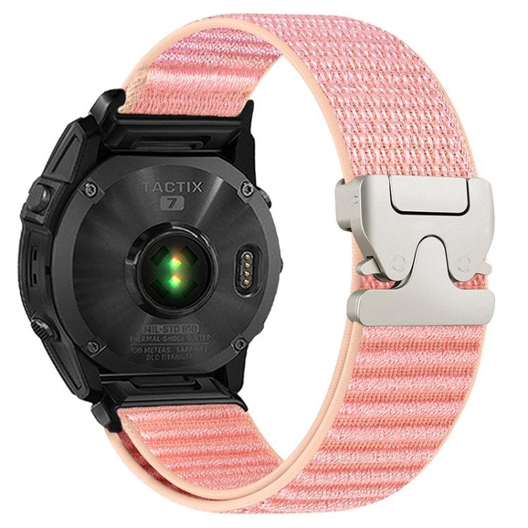 Pink woven nylon watch band with light metal parachute buckle on a black watch