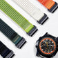 Woven nylon watch bands in green, cream, orange, teal and black with metal tips