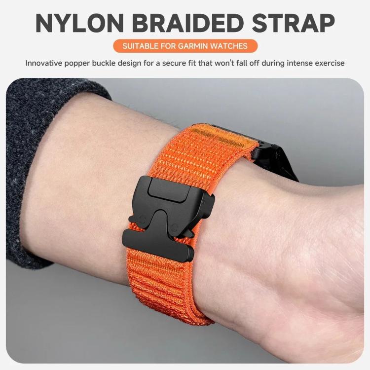 Orange nylon watch band with a black parachute-style buckle, worn on wrist