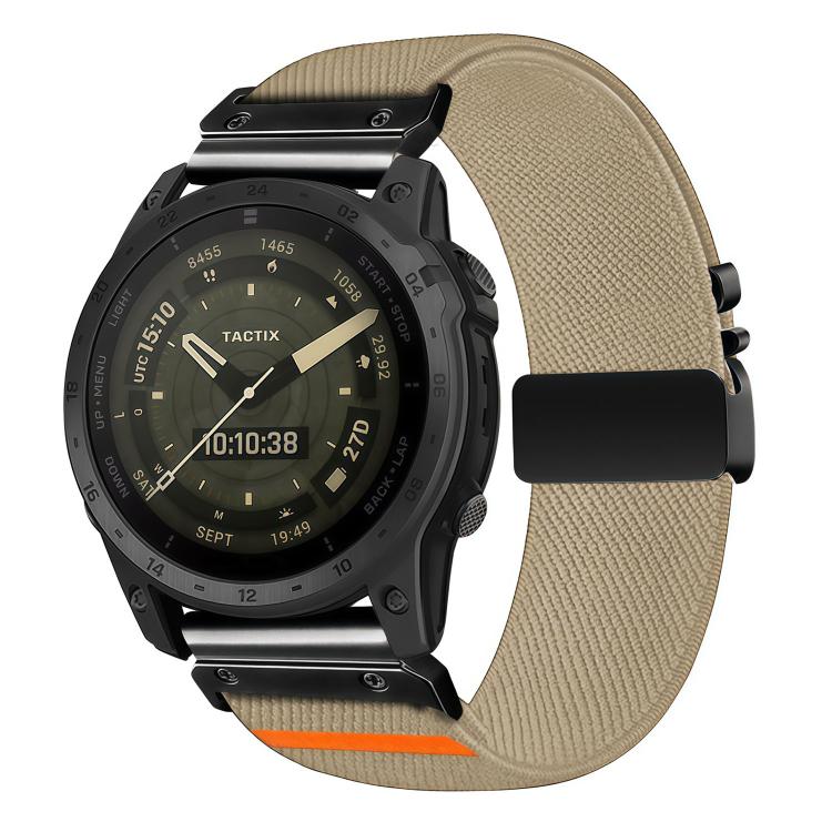 Beige diagonal-weave stretch nylon watch band with black buckle and orange accent, shown on a watch
