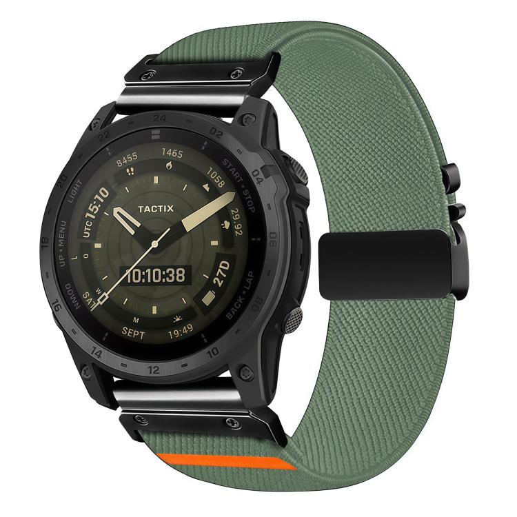 Muted green stretch nylon watch band with diagonal weave and black buckle, shown on a black watch.