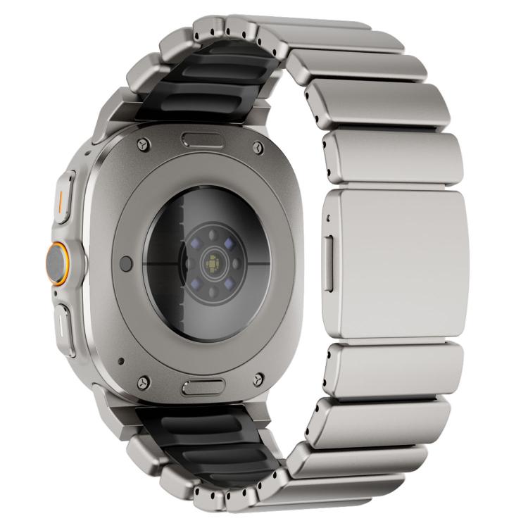 Back view of a silver smartwatch with a black silicone and stainless steel link band