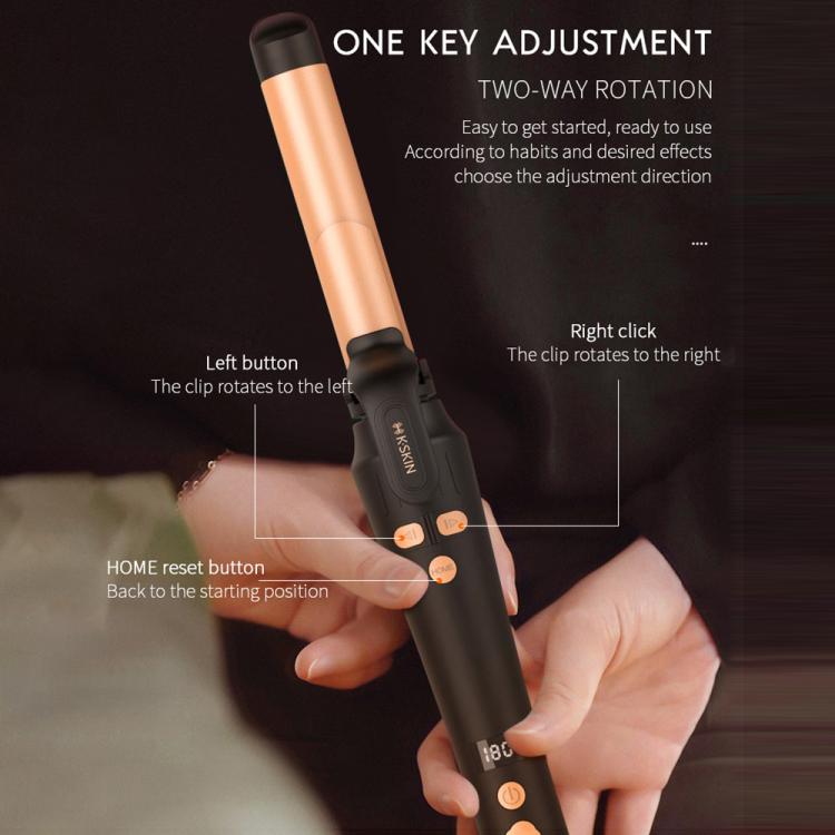 Automatic hair curler held in hand with black control area and gold barrel