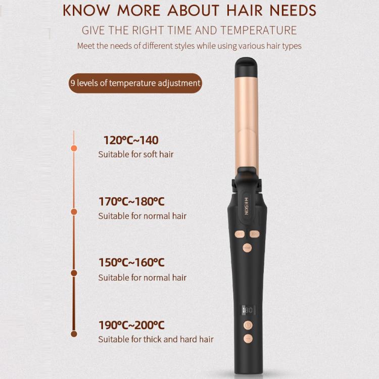 Automatic hair curler standing with gold barrel and black clip control buttons