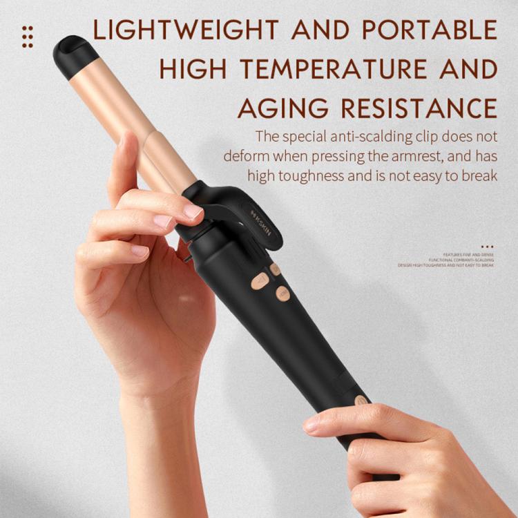 Lightweight portable automatic curler in hands, gold barrel over black handle