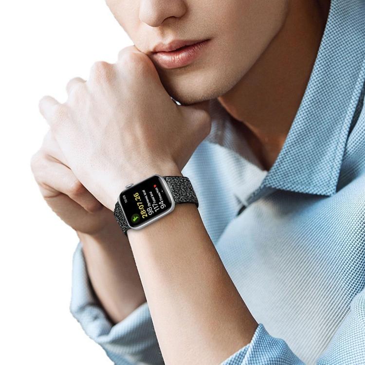 Black glitter watch band worn on a wrist with a smartwatch