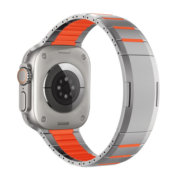 Silver stainless steel watch band with vivid orange accents, shown attached to a watch