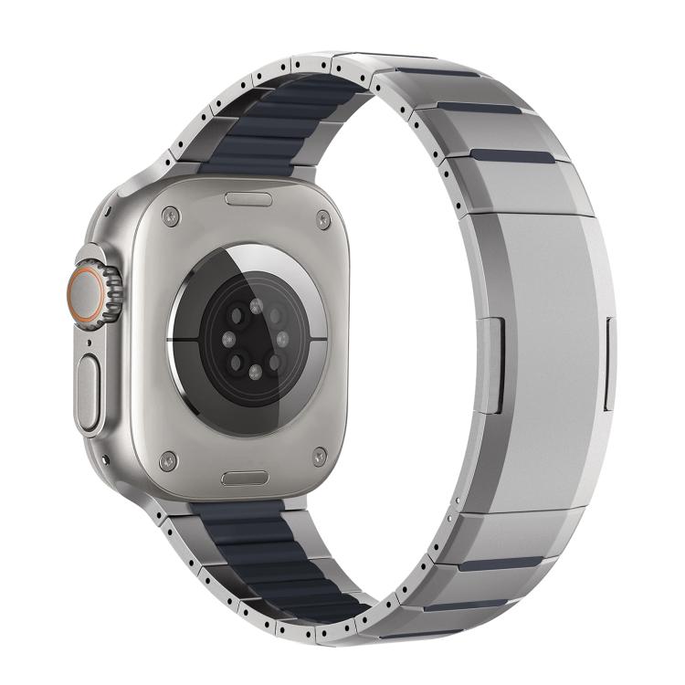 Two-tone stainless steel watch band with silver links and dark blue accents, shown attached to a watch