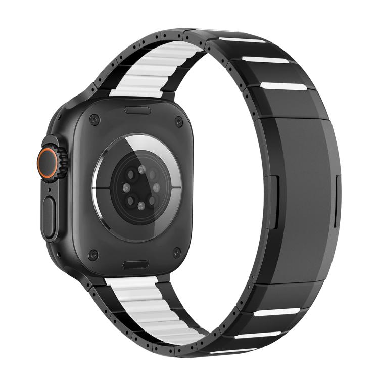 Black stainless steel watch band with white accents, shown attached to a watch