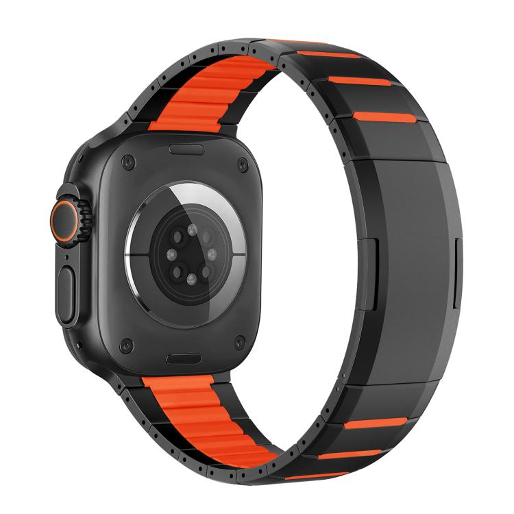 Black stainless steel watch band with vivid orange accents, shown attached to a watch