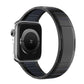 Black stainless steel watch band with dark blue accents, shown on a watch