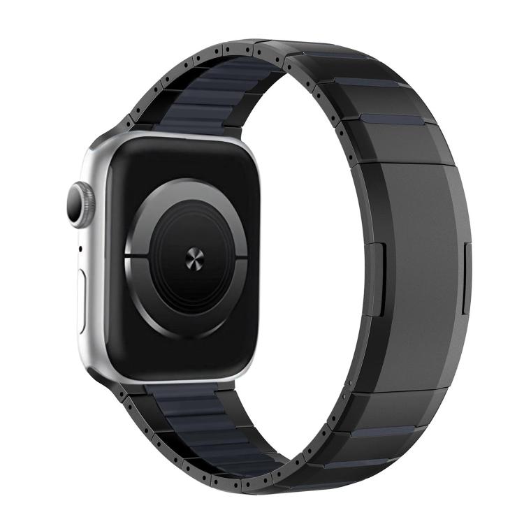 Black stainless steel watch band with dark blue accents, shown on a watch