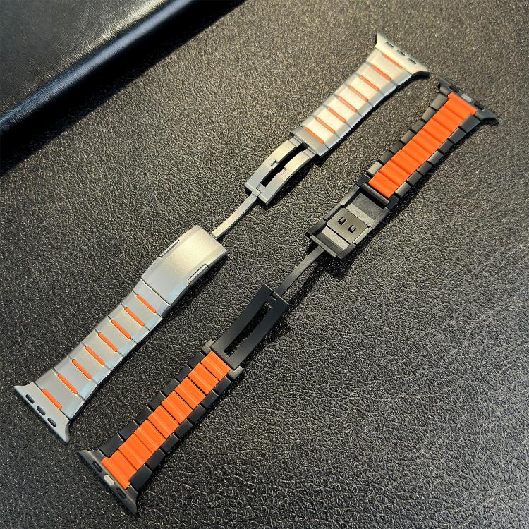 Silver and black stainless steel watch bands with orange accents and visible clasps