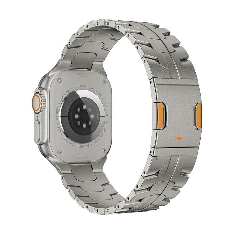 Titanium metal watch band attached to a smartwatch, with orange-accented magnetic clasp.