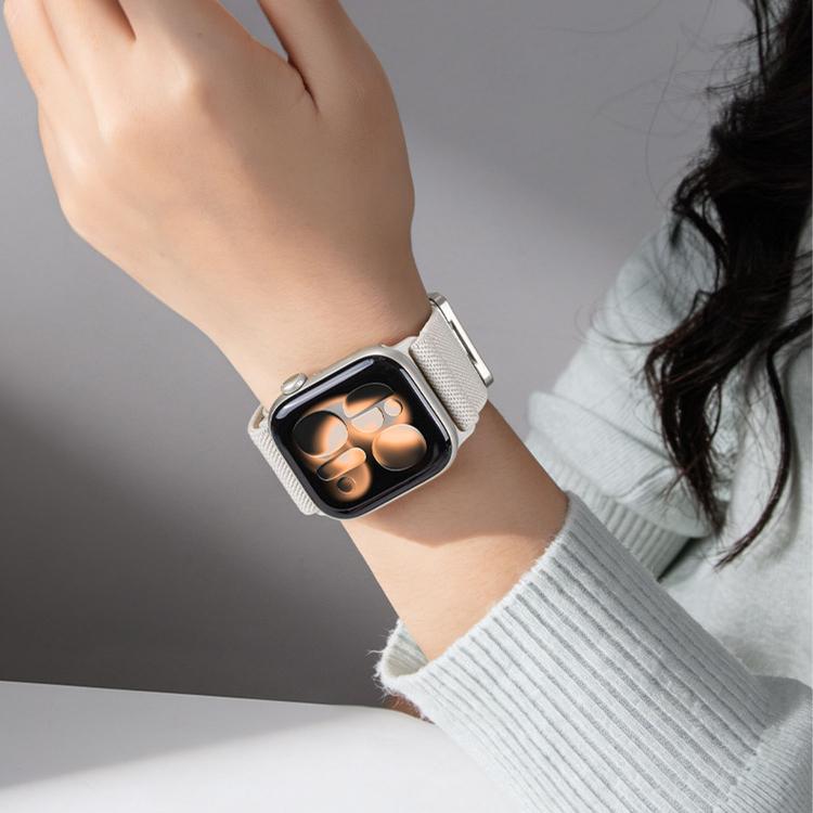 Light cream woven nylon watch band worn on a wrist with a smartwatch