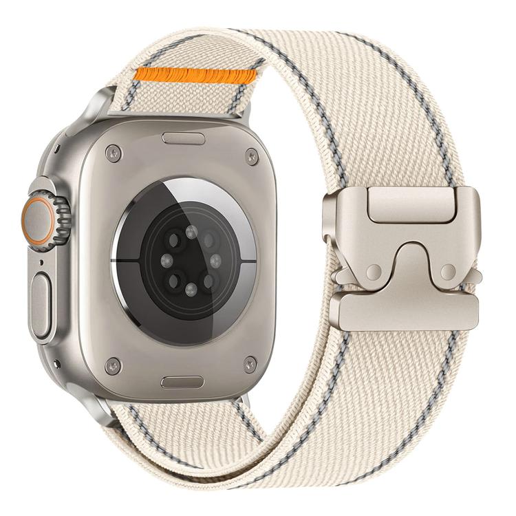 Starlight woven nylon Apple Watch band with gray stitching, orange accent and buckle