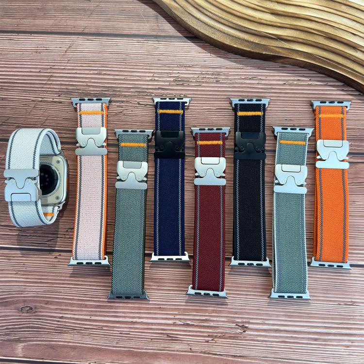 Woven nylon watch bands in several colors, arranged with reflective accents and buckles