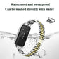 Two-tone stainless steel watch band attached to a watch, with seven-bead links