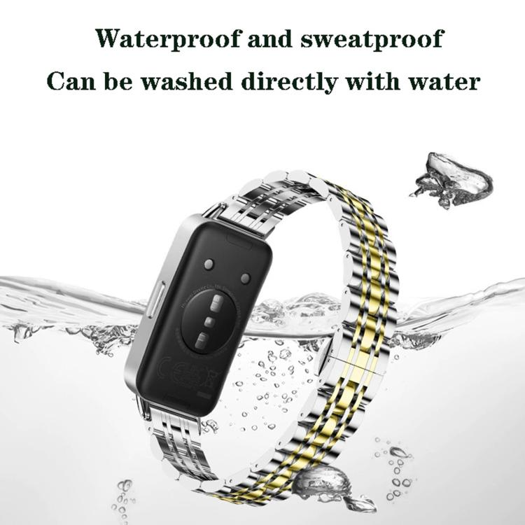 Two-tone stainless steel watch band attached to a watch, with seven-bead links