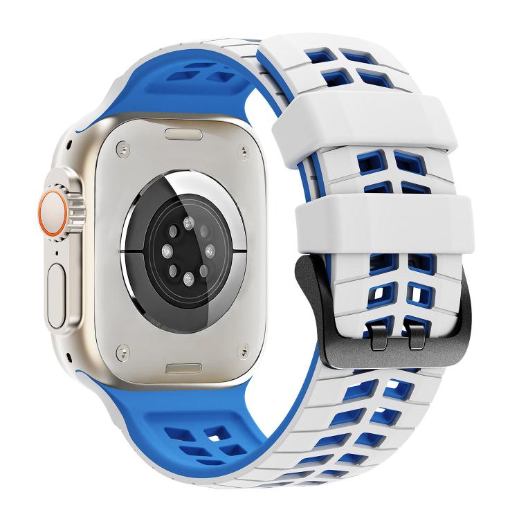 Reverse view of white and blue perforated silicone watch band fitted to a smartwatch.