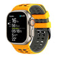 Yellow and dark gray perforated silicone watch band fitted to a smartwatch.