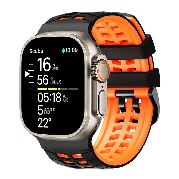 Black and orange perforated silicone watch band fitted to a smartwatch.