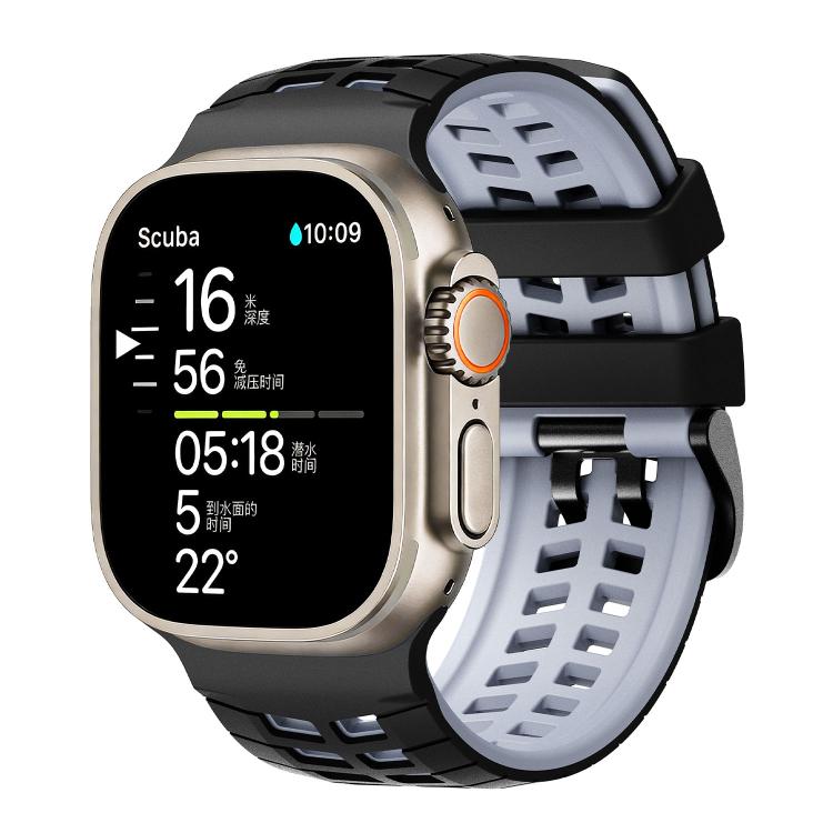 Two-tone silicone watch band with tire-tread slots, black exterior and light blue interior
