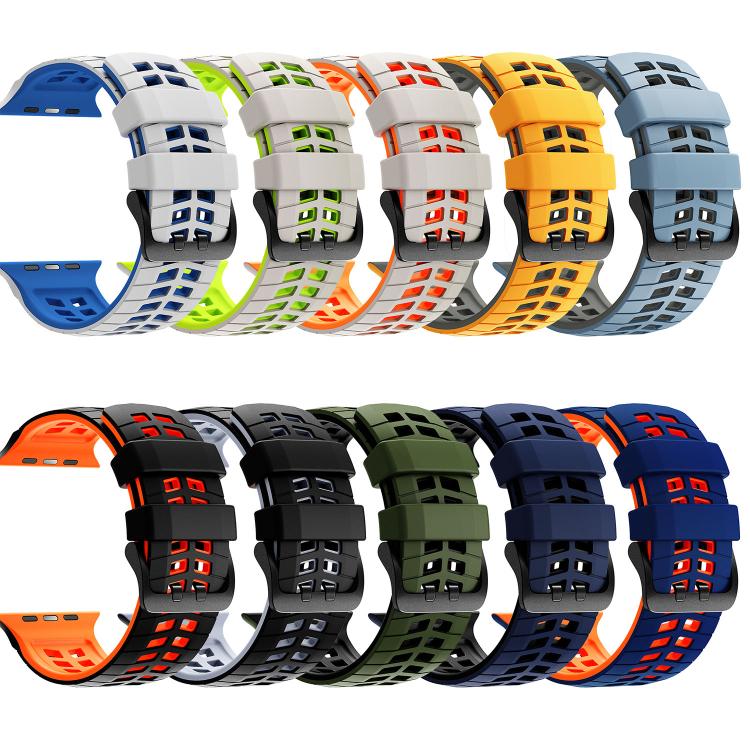 Assorted two-tone silicone watch bands with tire-tread slots and buckle closures