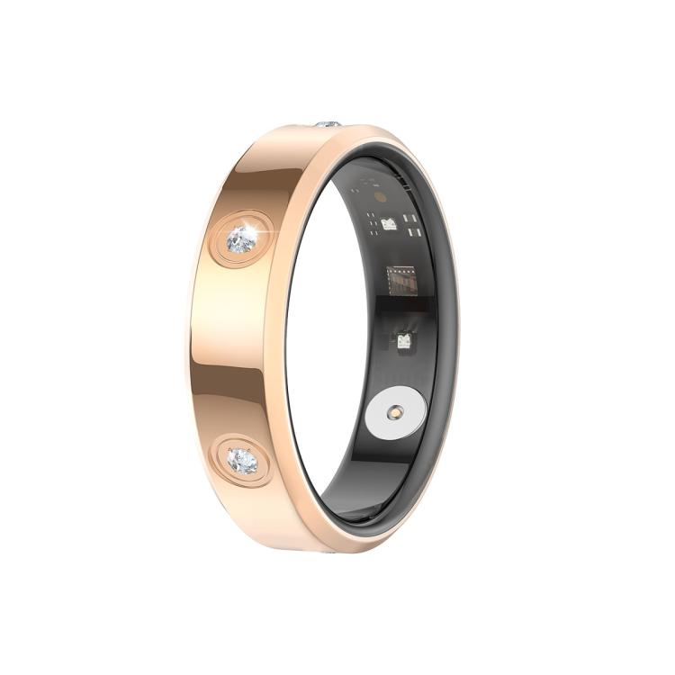 Gold-tone smart ring with clear stones and sensor components inside.