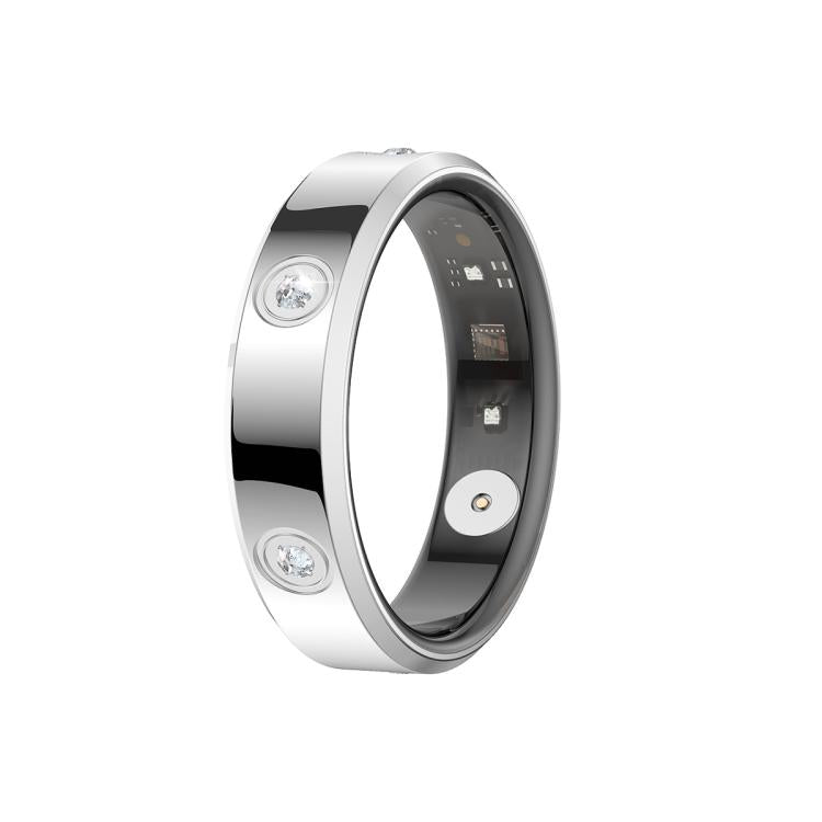 Silver-tone smart ring with clear stones and visible inner sensor components.
