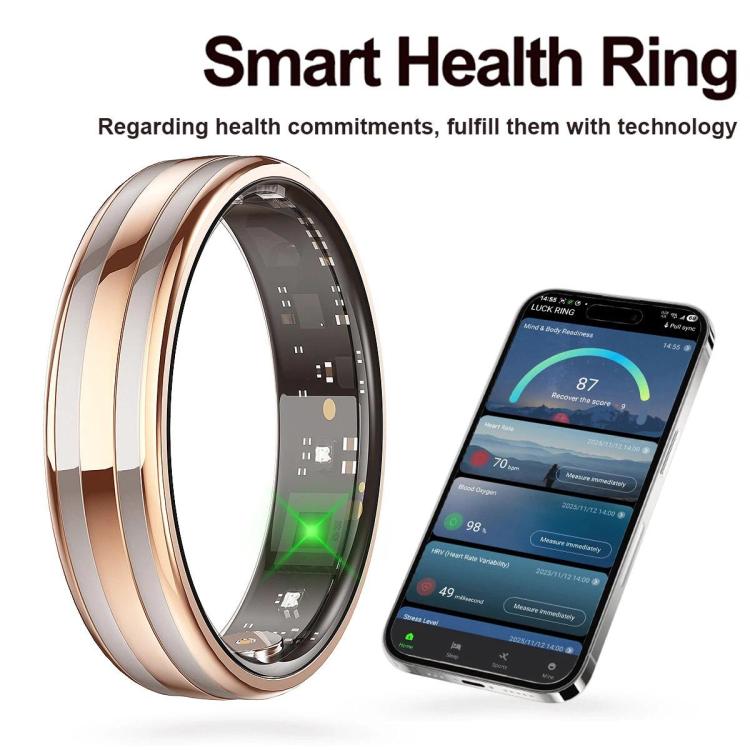 Rose gold and silver smart ring beside a phone displaying health data