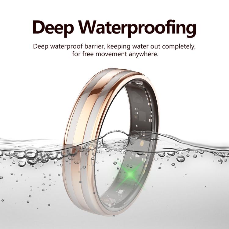 Rose gold and silver smart ring shown partially submerged in water